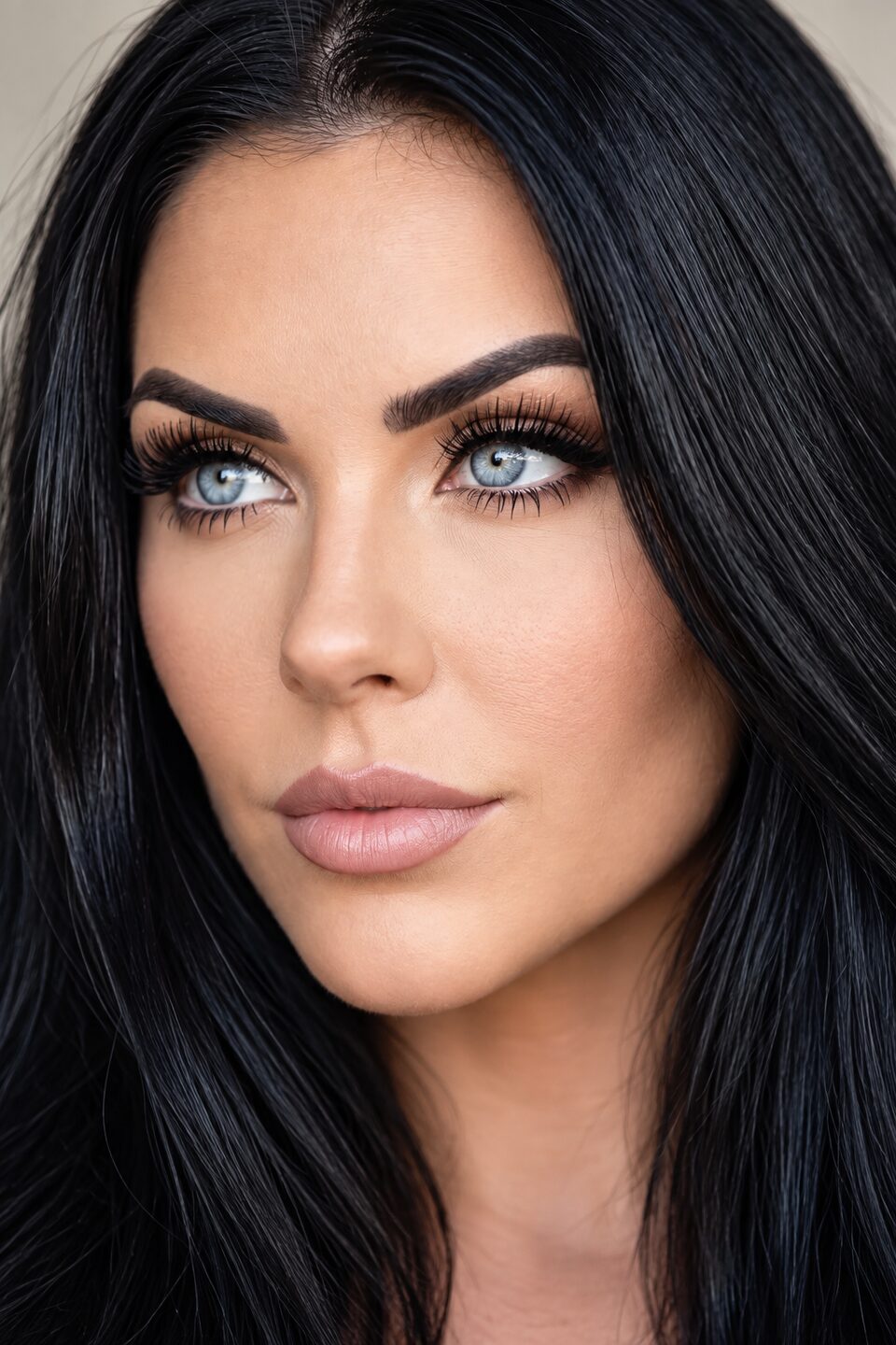 Close-up of Dahlia Ferrante, eyes turned away from the camera, soft glam make-up
