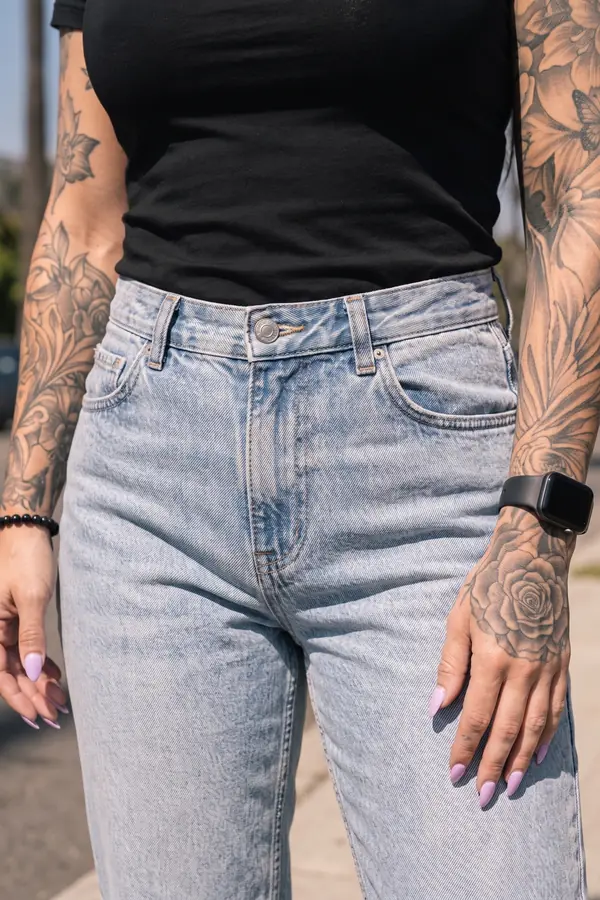 detail: Black crew-neck tee with light-wash straight jeans
