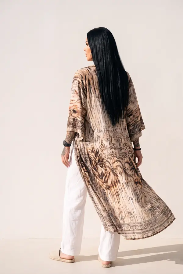 back & profile: Black cut-out bodysuit with white linen wide-leg trousers