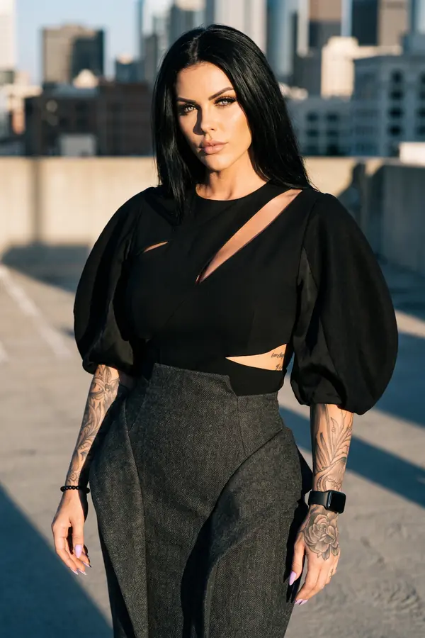 full look: Black cut-out puff-sleeve top and charcoal tweed skirt