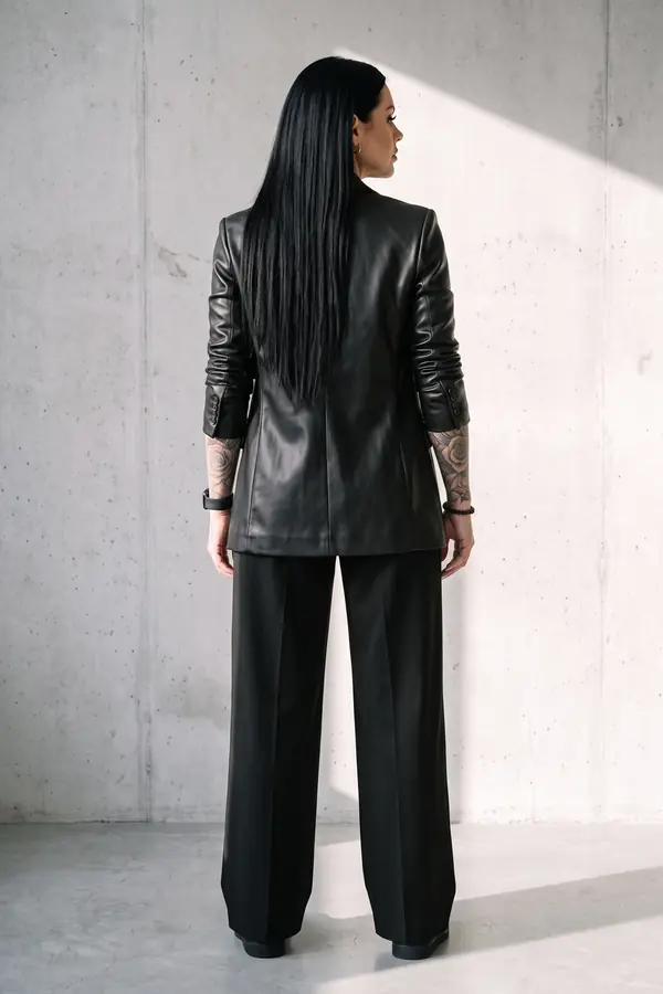 back & profile: Black leather blazer with satin cami and wide-leg trousers