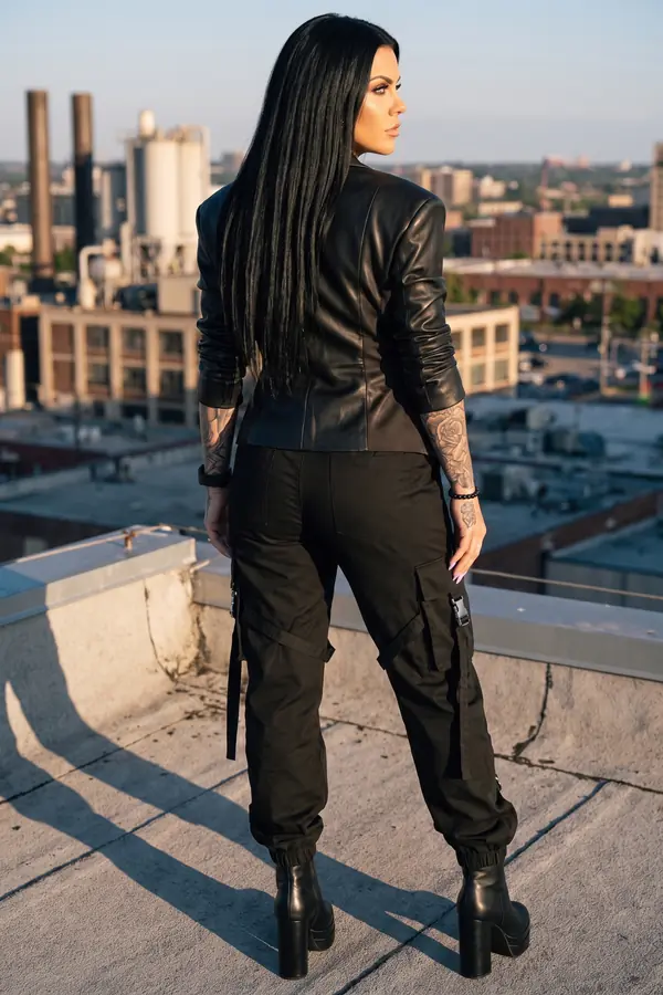 back & profile: Black leather blazer with strap-and-buckle cargo trousers