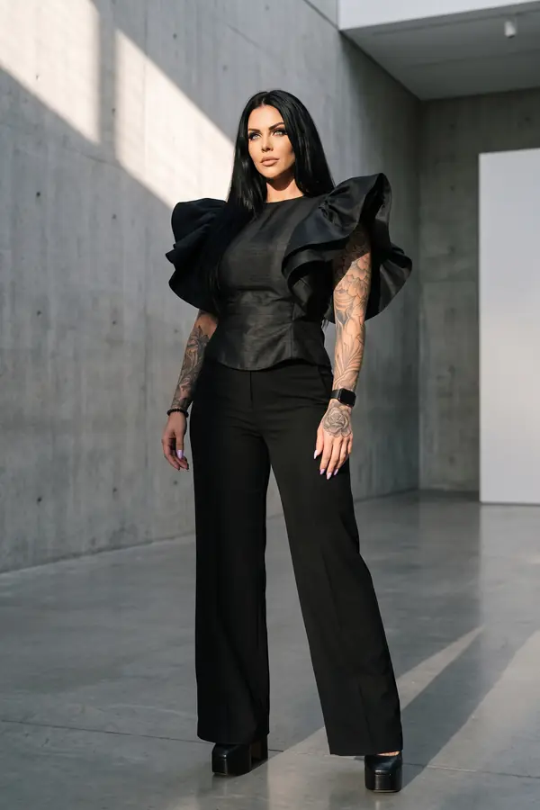 in motion: Black shantung ruffle-shoulder top with wide-leg trousers