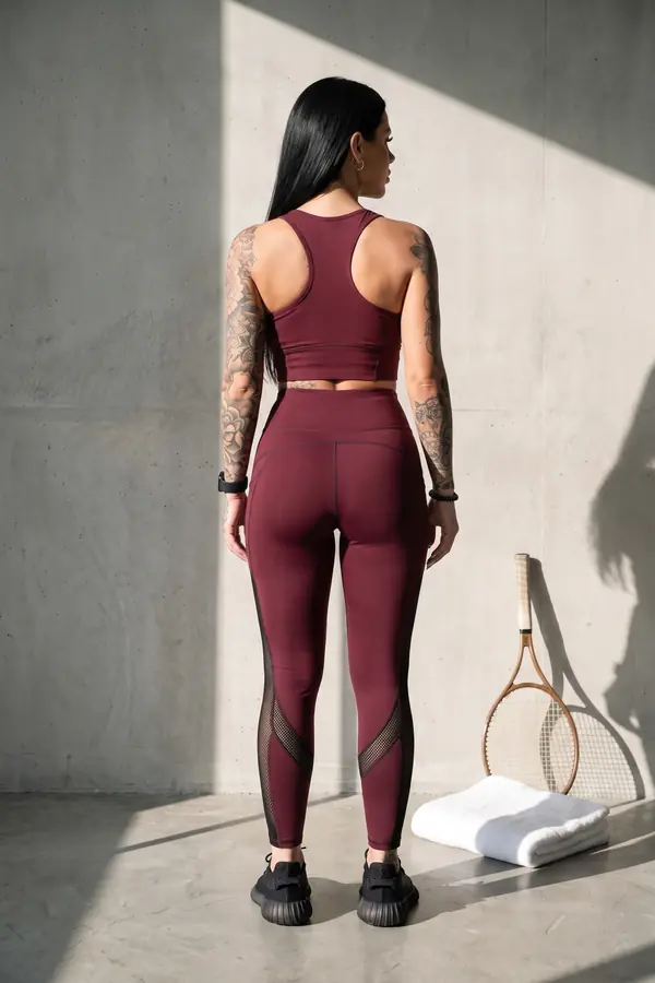back & profile: Burgundy crop top and leggings with mesh panels