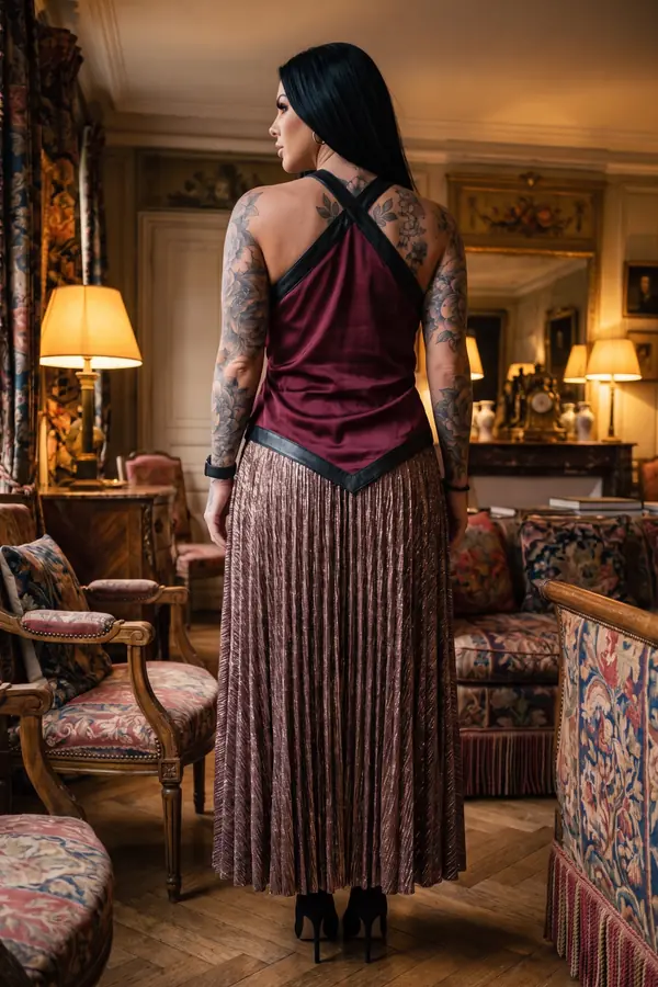 back & profile: Burgundy satin halter top with a bronze plissé maxi skirt