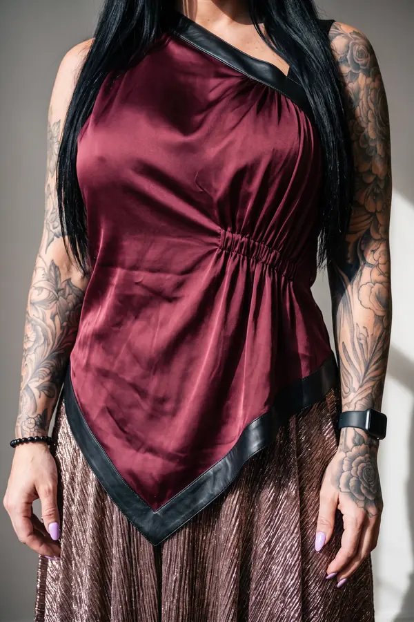 detail: Burgundy satin halter top with a bronze plissé maxi skirt
