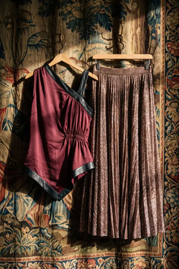 still life: Burgundy satin halter top with a bronze plissé maxi skirt