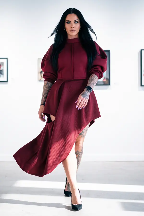 in motion: Burgundy scuba puff-sleeve top and asymmetric skirt