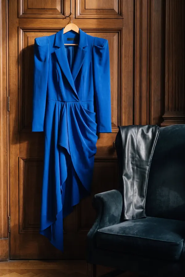 still life: Cobalt draped blazer dress over black leather trousers