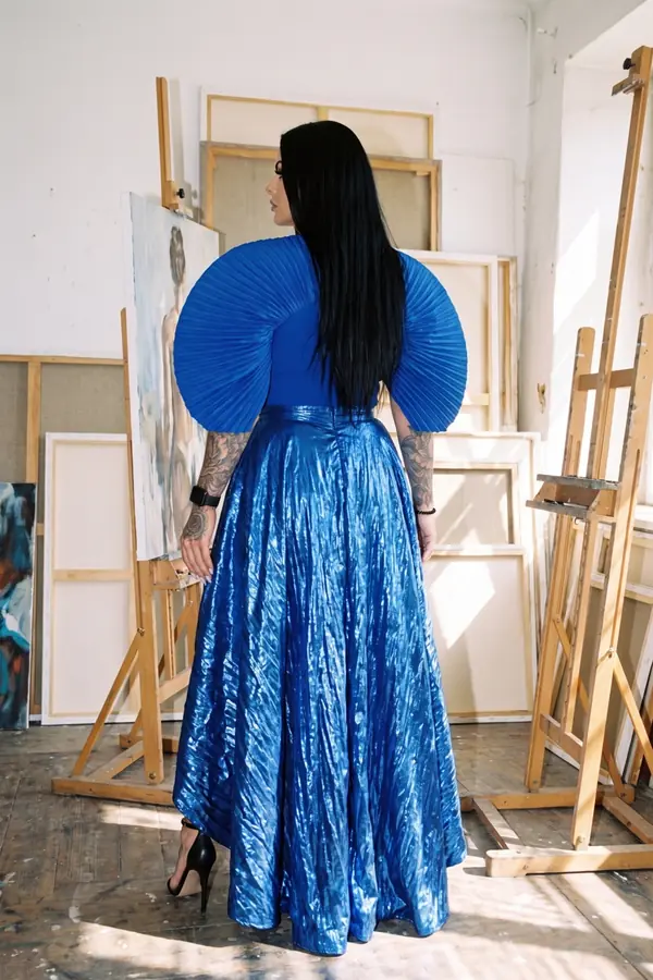 back & profile: Cobalt fan-sleeve top with metallic crinkle maxi skirt