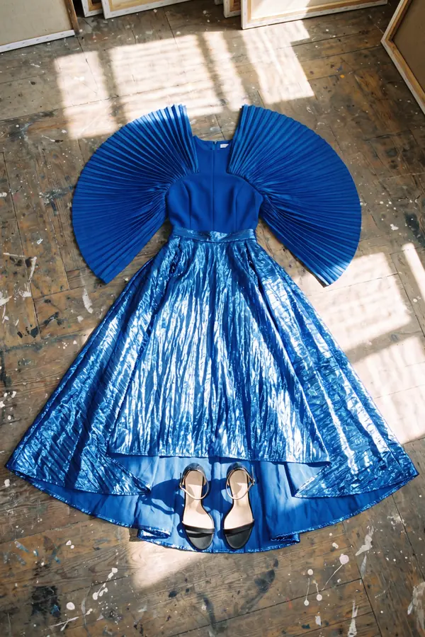 still life: Cobalt fan-sleeve top with metallic crinkle maxi skirt