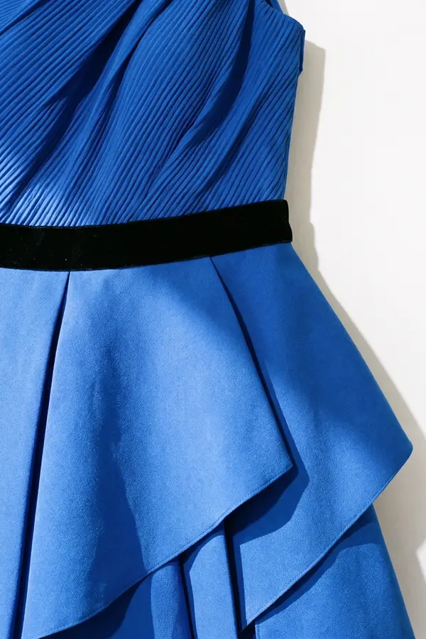 detail: Cobalt one-shoulder mini dress with a tiered origami skirt