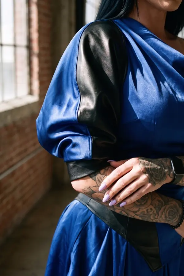 detail: Cobalt one-shoulder satin gown with leather panels
