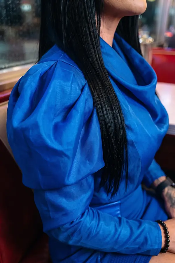 detail: Cobalt organza puff-sleeve top with satin panel mini skirt