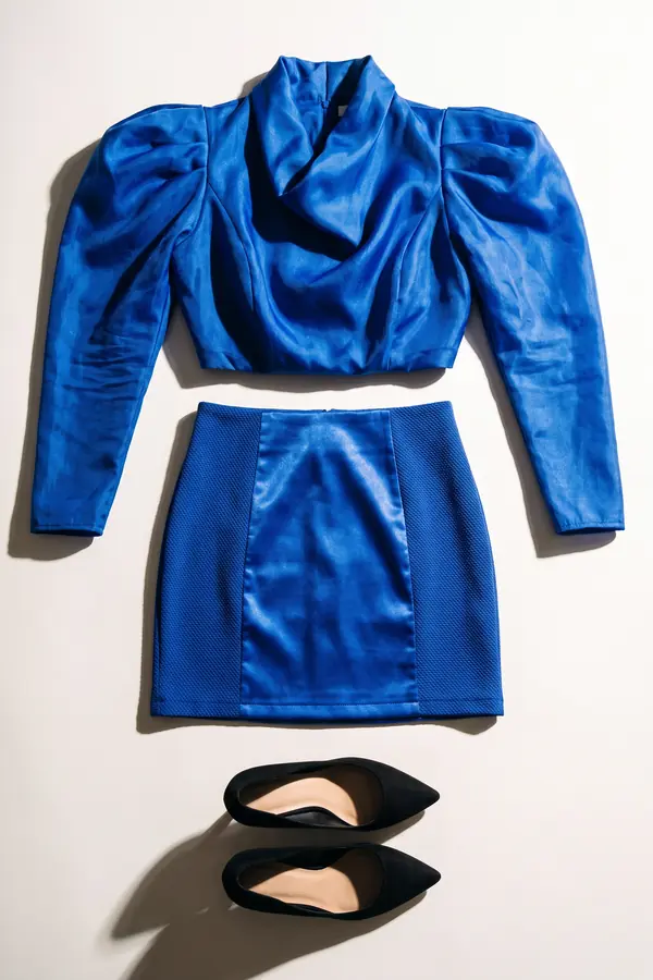 still life: Cobalt organza puff-sleeve top with satin panel mini skirt