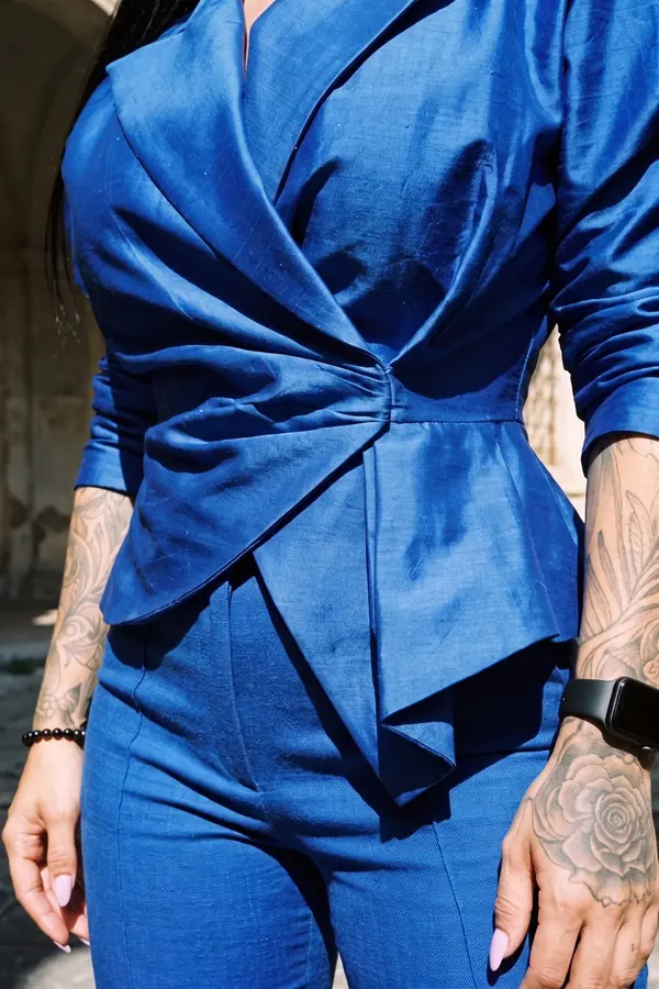 detail: Cobalt peplum wrap blazer with slim linen trousers