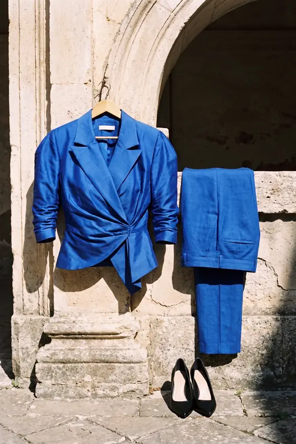 still life: Cobalt peplum wrap blazer with slim linen trousers
