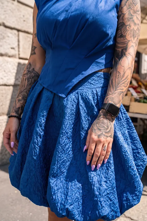 detail: Cobalt pleated sleeveless top with a cloqué bubble skirt