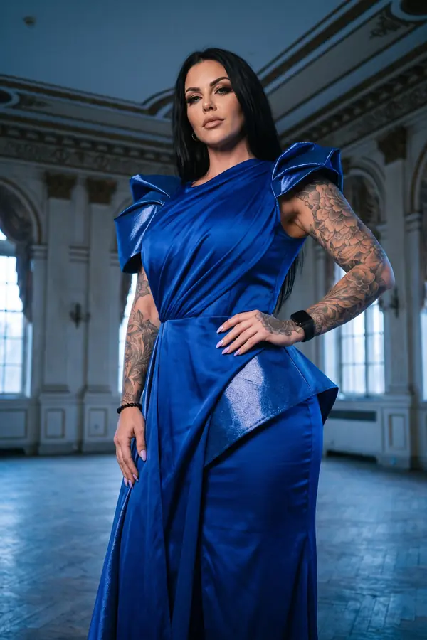 full look: Cobalt satin draped gown with structured bow shoulders