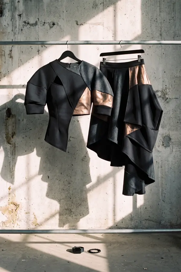 still life: Colour-block panelled top and asymmetric skirt in bronze