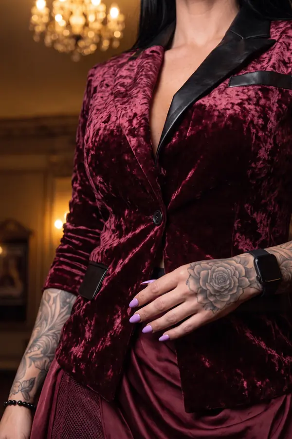 detail: Crushed velvet blazer with leather lapels and mesh skirt