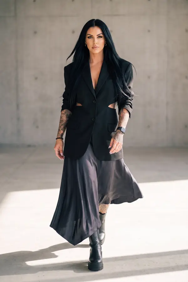 in motion: Cut-out blazer with charcoal satin asymmetric midi skirt