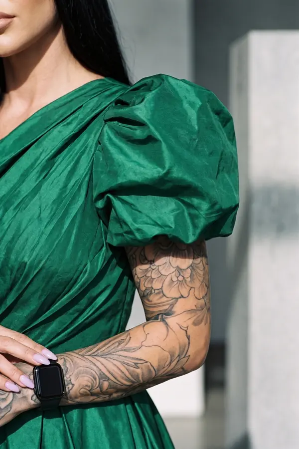 detail: Emerald taffeta puff-sleeve dress with bubble high-low hem