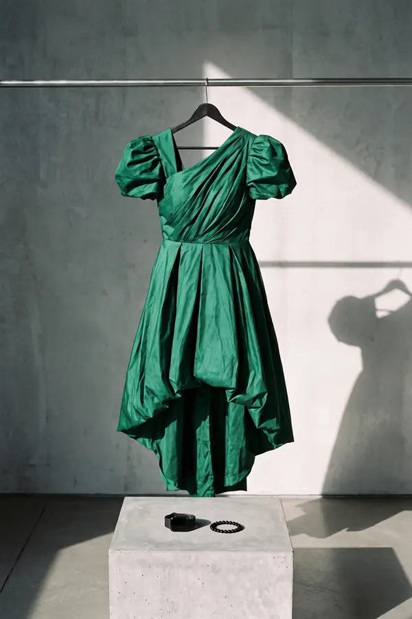 still life: Emerald taffeta puff-sleeve dress with bubble high-low hem