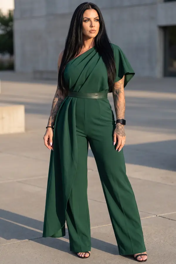 in motion: Forest green one-shoulder jumpsuit with draped cape panel
