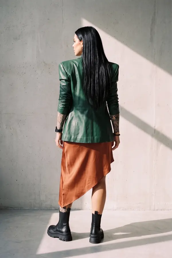 back & profile: Green leather blazer over a rust satin slip dress