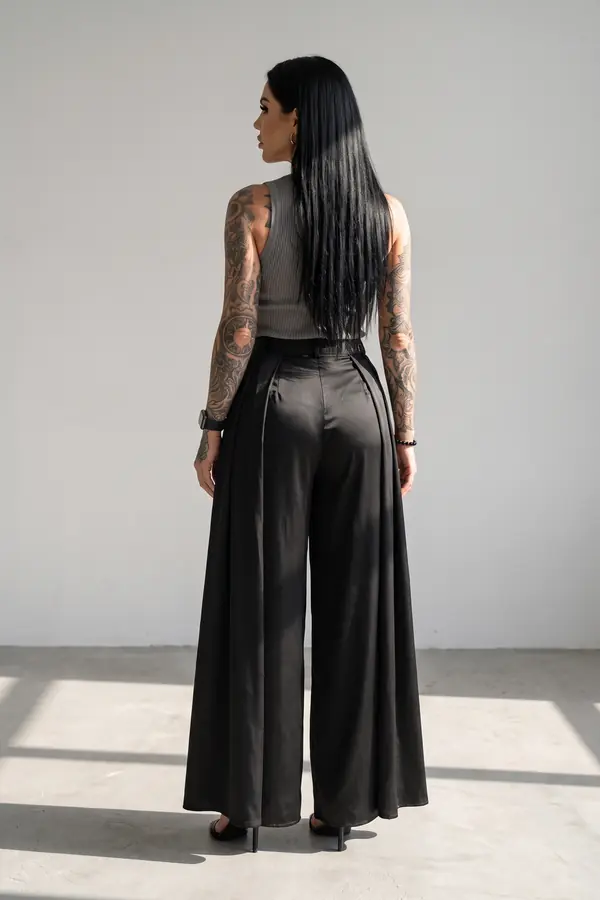 back & profile: Grey ribbed tank with satin wide-leg trousers and overskirt