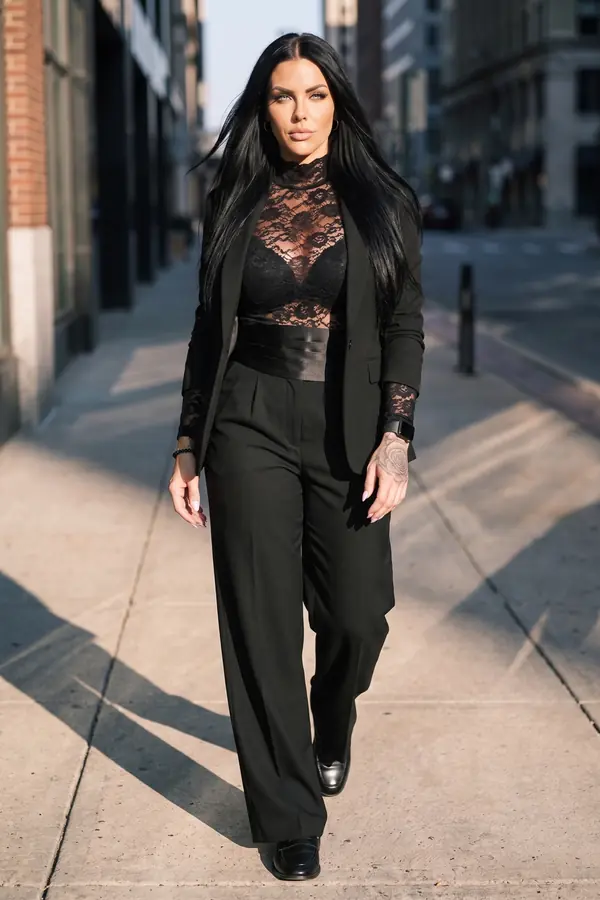 in motion: High-neck lace top, wide-leg trousers and a cummerbund