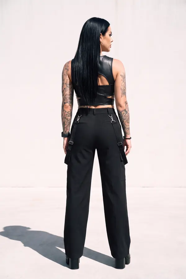 back & profile: Leather cut-out bustier with clip-strap wide-leg trousers
