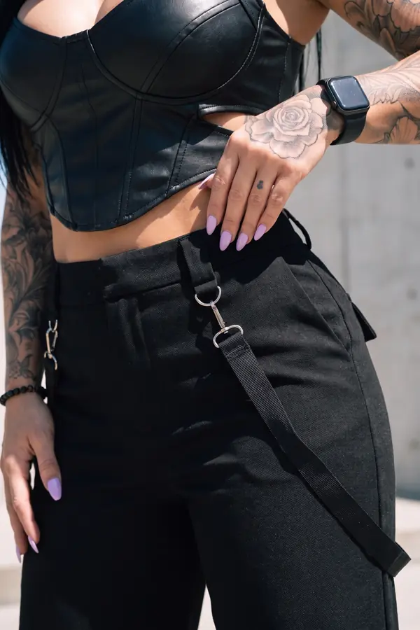 detail: Leather cut-out bustier with clip-strap wide-leg trousers