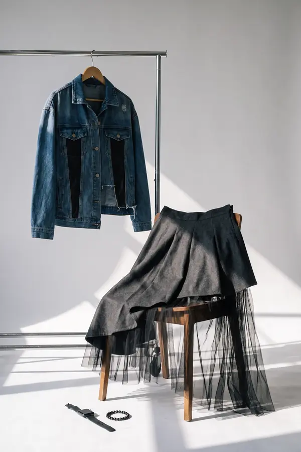 still life: Leather-panel denim jacket and asymmetric wool skirt