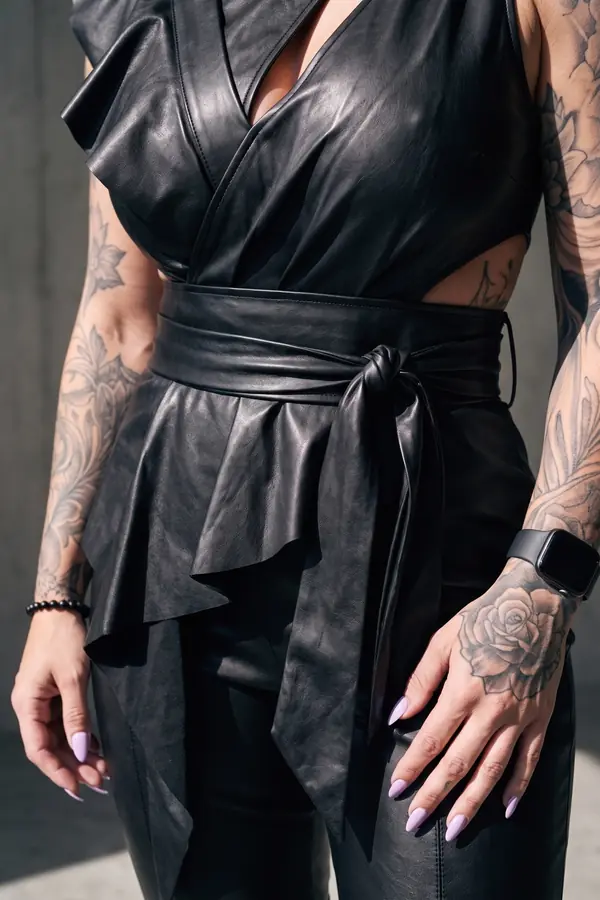 detail: Leather ruffle wrap top with sash and tapered trousers