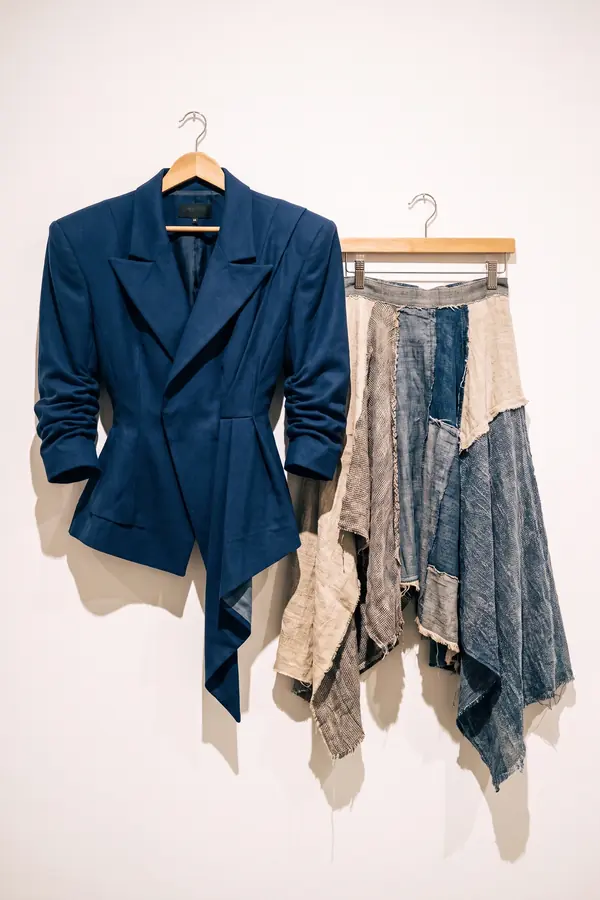 still life: Navy sculpted-shoulder blazer over a patchwork skirt