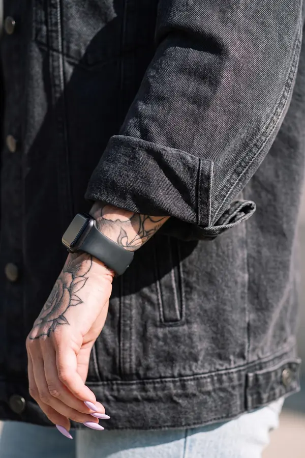 detail: Oversized black denim jacket with light-wash straight jeans