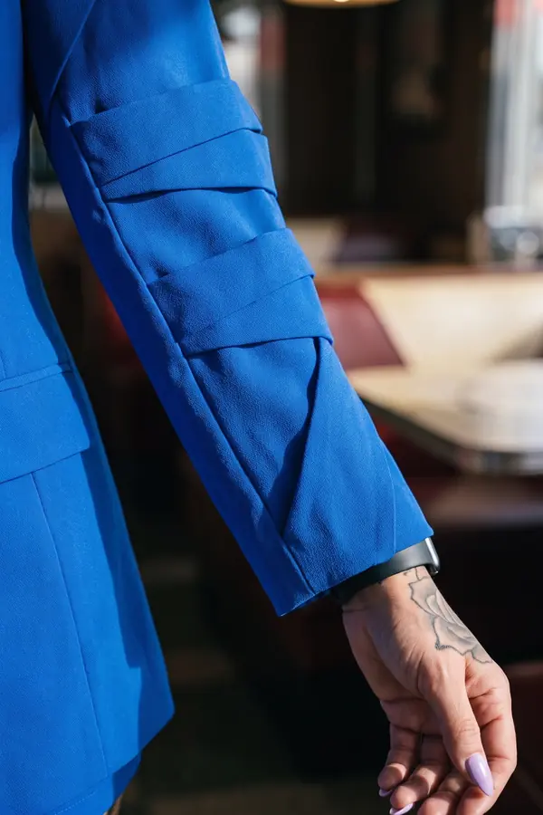 detail: Oversized cobalt blazer dress with layered sleeves