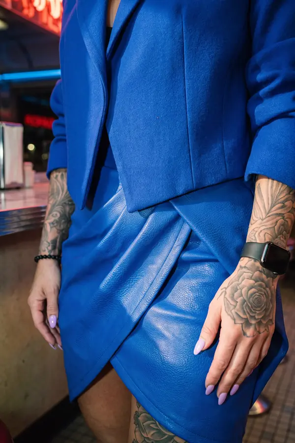 detail: Oversized cobalt wool blazer with a leather wrap mini skirt