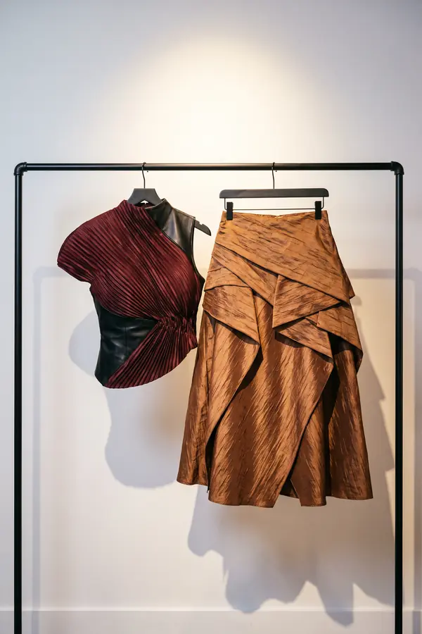still life: Oxblood plissé top with a leather corset and taffeta skirt