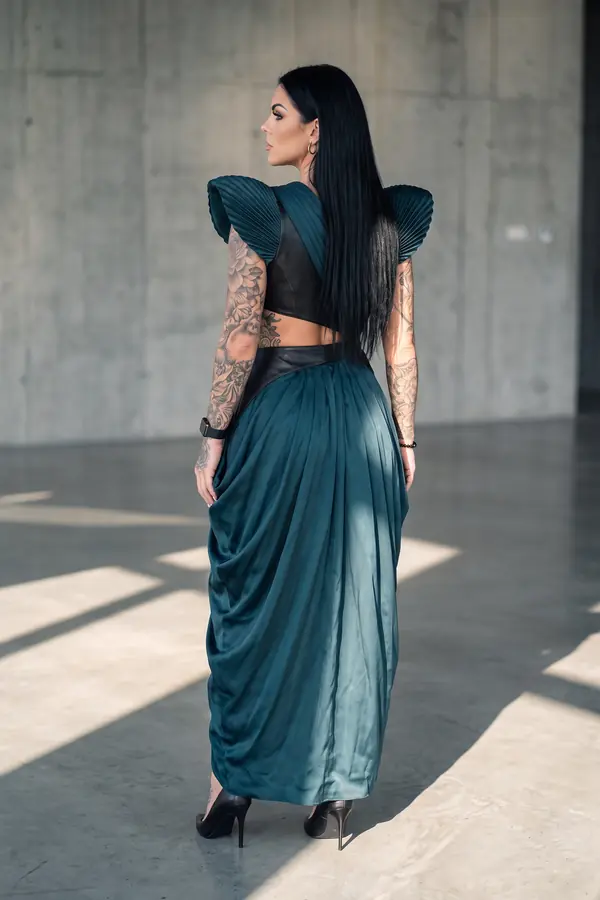 back & profile: Petrol satin and leather gown with pleated shoulders