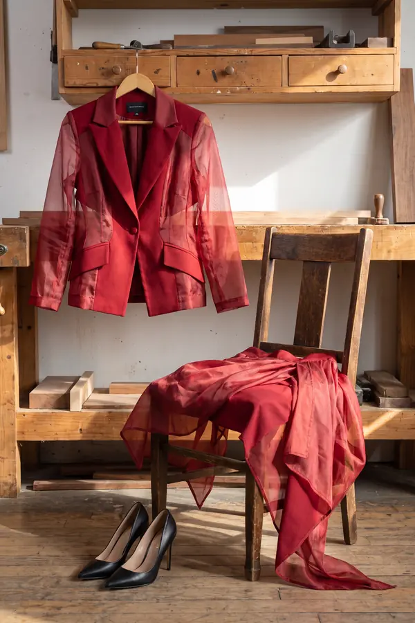 still life: Red crepe blazer with organza sleeves and layered skirt