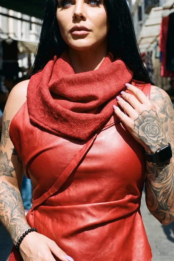 detail: Red leather wrap top and linen wide-leg trousers