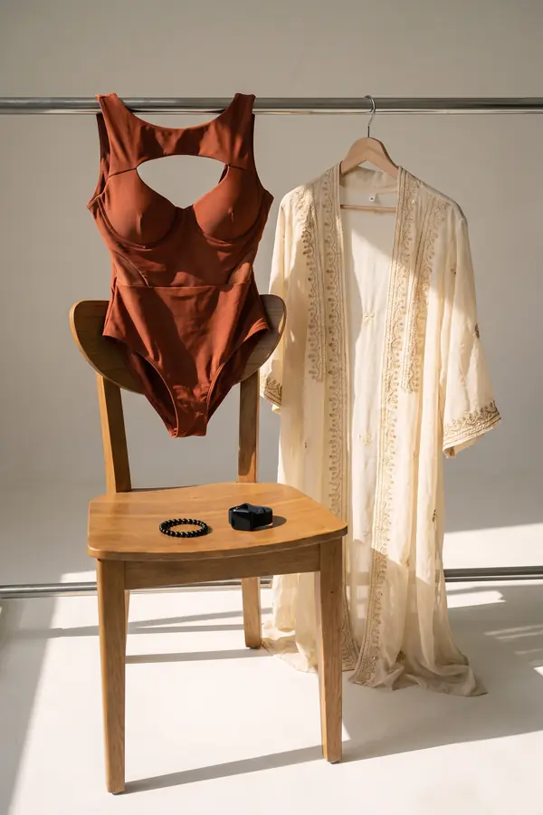 still life: Rust cut-out swimsuit under an embroidered chiffon kaftan
