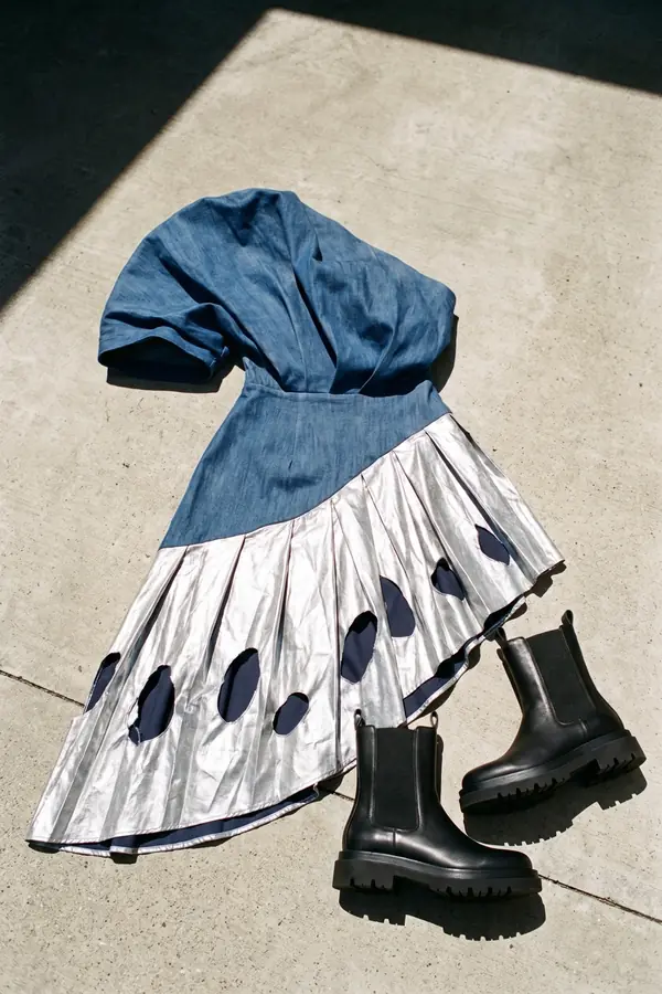 still life: Sculpted denim dress with a silver cut-out pleated skirt