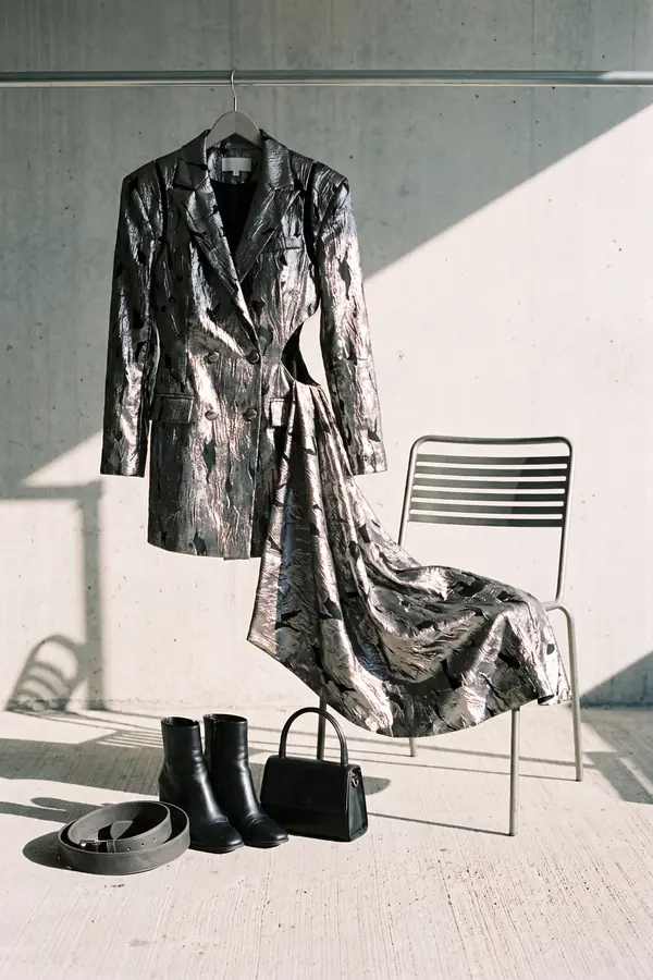 still life: Silver brocade blazer dress with leather belt and cut-outs