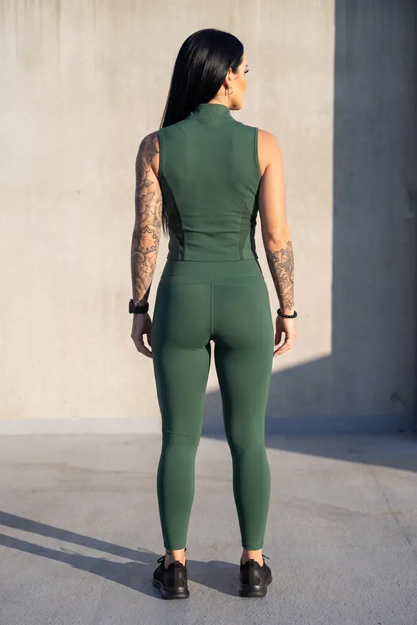 back & profile: Sleeveless green zip-front training top and leggings